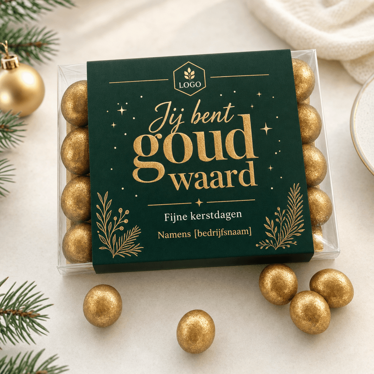 Christmas box with golden chocolate pearls and sleeve